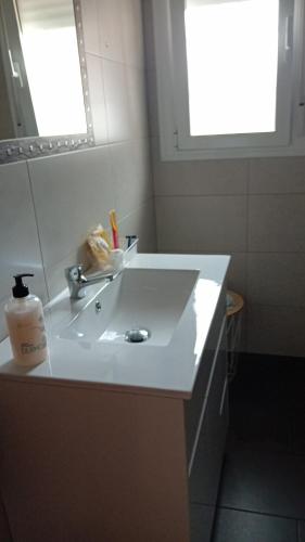 a bathroom with a white sink and a mirror at Casa Rural Plaza Zahara Buenas Vistas in Zahara de la Sierra
