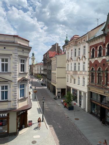 an empty street in a city with buildings at Apartament ST1 in Cieszyn