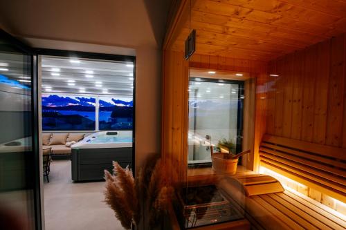 a room with a sauna with a view of a tub at Villa Felicità, Biograd na Moru, Zadar in Biograd na Moru
