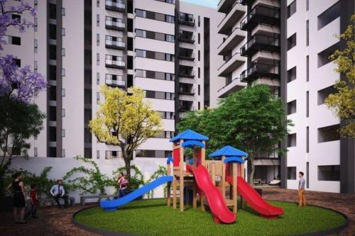 a playground with a slide in a park at Atemajac Apartment 1parking/2BR/2BA in Guadalajara