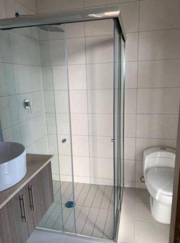 a bathroom with a shower and a toilet at Atemajac Apartment 1parking/2BR/2BA in Guadalajara
