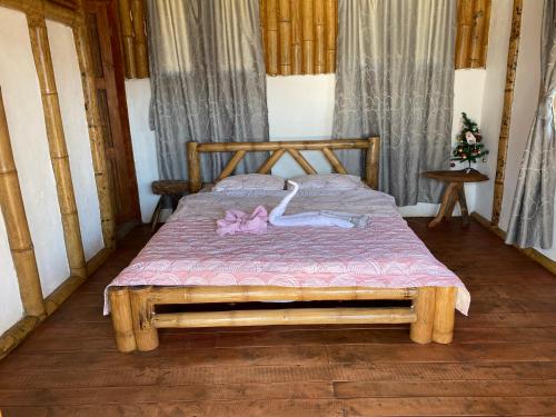 Una cama o camas en una habitación de Cabañas Ecoturismo Evy