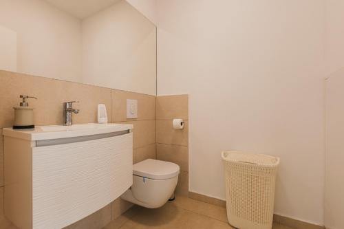 a bathroom with a toilet and a sink at VILLA JADRANKA in Krnica