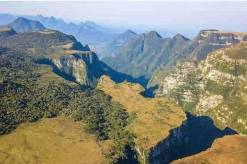 an aerial view of a canyon with trees and mountains at Aconchegante Quitinete Próximo ao Centro/Criciúma. in Criciúma