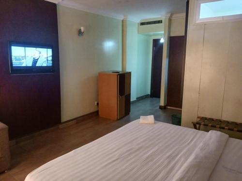 Cama o camas de una habitación en Equity resort hotel ijebu
