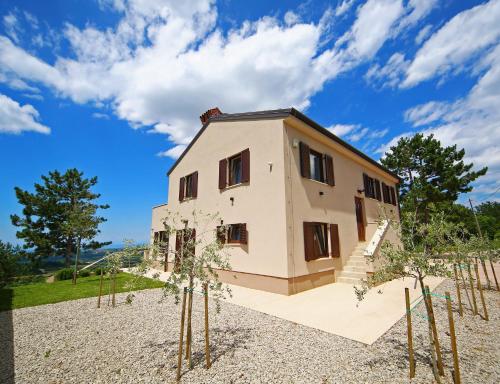 a house with trees in front of it at Luxury Villa Gradin in Gračišče