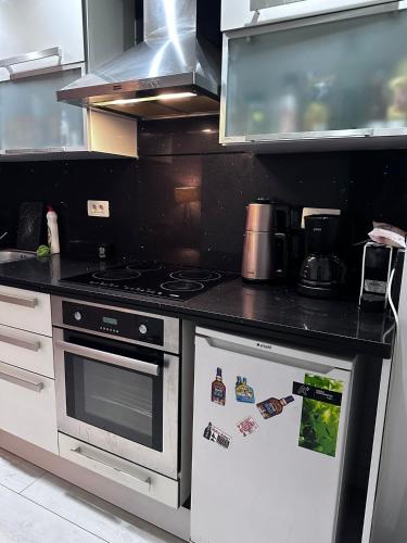 a kitchen with a stove with stickers on it at studio cozy Home in Istanbul