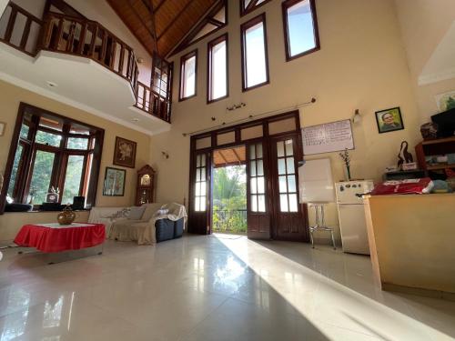 a large room with a kitchen and a living room at 中国蒲公英民宿Dandelion Guest house Villa with Mount View in Kandy