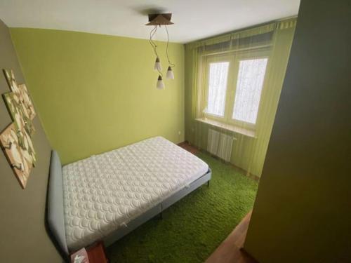 Lova arba lovos apgyvendinimo įstaigoje Apartament Krośnieńska