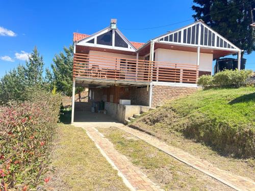 a house on the side of a hill at Chalet Familiar Delpilar, Full equipado, zona de Jacuzzi! in Sogamoso