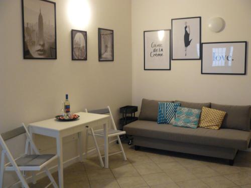 a living room with a couch and a table at CASA SANGALLO in Prato