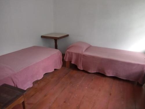 Ein Bett oder Betten in einem Zimmer der Unterkunft Pousada Inaya