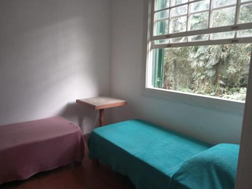 Ein Bett oder Betten in einem Zimmer der Unterkunft Pousada Inaya