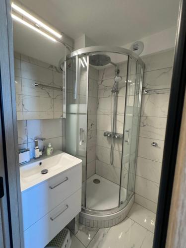 a bathroom with a shower and a sink at Happy Yeti Avoriaz in Avoriaz