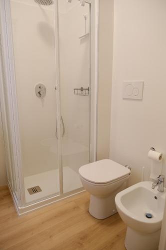 a bathroom with a shower and a toilet and a sink at Politecnico Bovisa university apartment in Milan