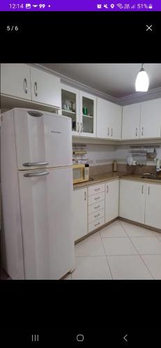 Kuchyň nebo kuchyňský kout v ubytování Apartamento a 2 Minutos da Praça!