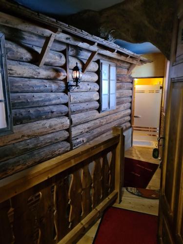 a log cabin with a light on the wall at Haslaustube in Schwarzenbach an der Pielach