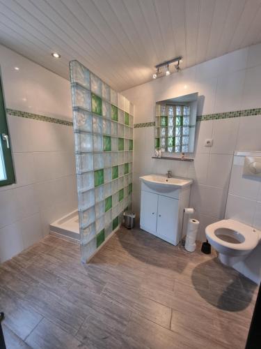 a bathroom with a toilet and a sink at Chez Lilo in Fos-sur-Mer