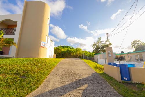 a driveway leading up to a house at Colinas del Atlantico Vacational House 1st floor in Isabela