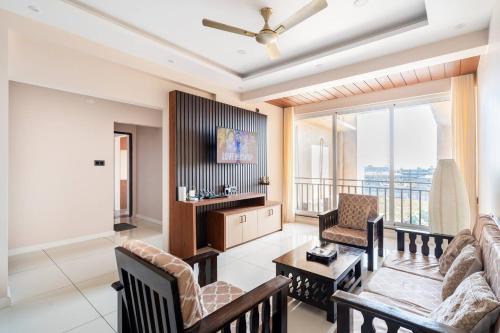 a living room with a couch and a table at MYKA SD ZANITA HEIGHTS in Vasco Da Gama