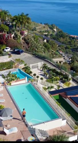an overhead view of a swimming pool at a resort at Taormina Skyline in Taormina
