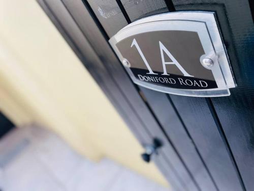 a sign on the side of a door of a vehicle at Ground floor entire costal apartment in Watchet. in Watchet