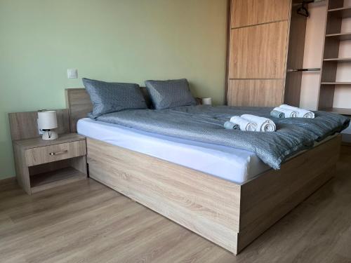 a bed with two pillows on it in a bedroom at Cappuccino apartment in Sofia