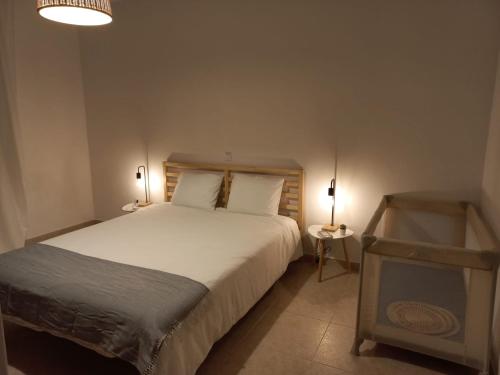 מיטה או מיטות בחדר ב-Casa da Vila - Malhadais