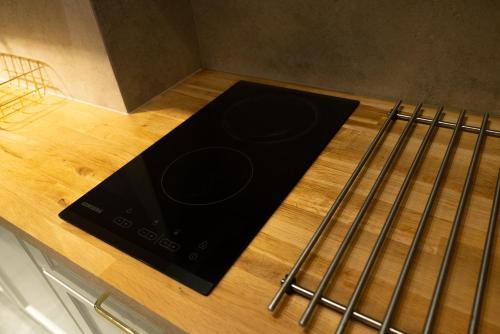 a stove top oven sitting on top of a counter at GOLD apartamenty & spa in Szczawnica