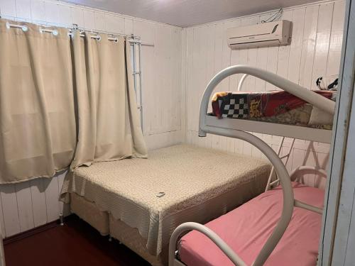 Una cama o camas en una habitación de Casa de Praia