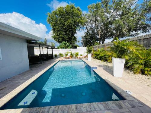 a swimming pool in the backyard of a house at Sarasota Paradise home near Siesta Key Beach in Sarasota