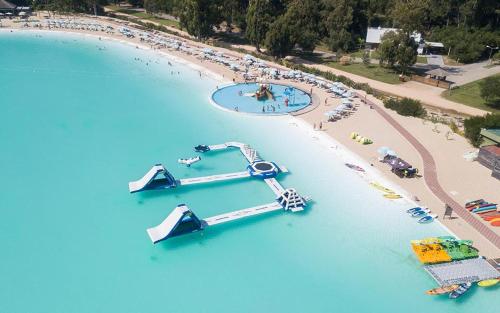 an aerial view of an island with a water park at Solanas Forest Semana in Punta del Este