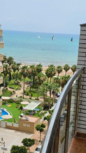 a view of the beach from the balcony of a resort at Lorena Flat, 2 rooms 2 bath Seaview in Oropesa del Mar
