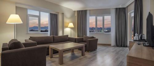 a living room with a couch and a table at Wyndham Garden Lara in Lara