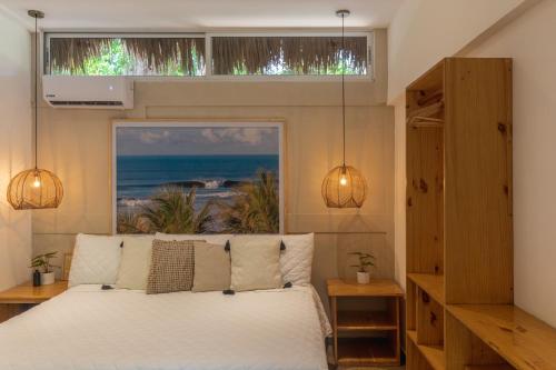 En eller flere senge i et værelse på Hotel Michanti