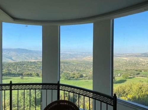 a balcony with a view of the countryside at مزرعة طلة الهيبة in Jal‘ad