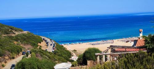 a beach with a crowd of people on it at BlueMaison in Torre Dei Corsari