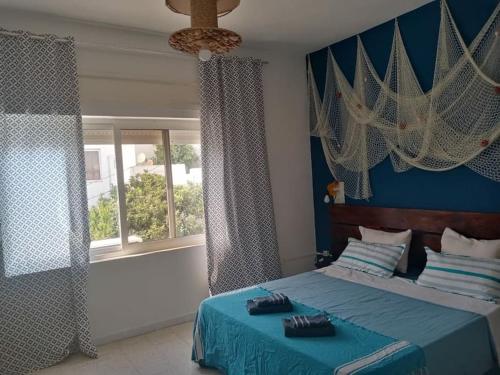 Ένα ή περισσότερα κρεβάτια σε δωμάτιο στο Perle Du Banlieue Nord