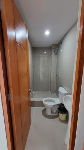 a bathroom with a toilet and a sink at HOSTAL EL EMBRUJO 2 