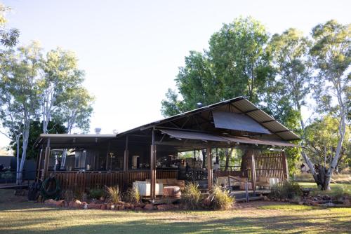 a house with a porch with a roof at Bell Gorge Wilderness Lodge in King Leopold Ranges