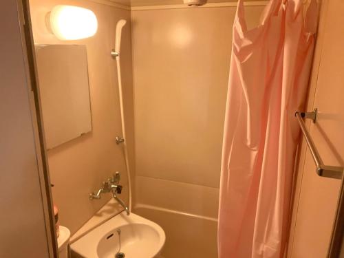a bathroom with a sink and a toilet and a shower at Nishimoto Building - Vacation STAY 16004v in Hiroshima