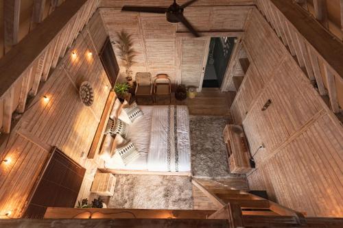 an overhead view of a room with wooden walls at Garden Terrace Bali in Gobleg