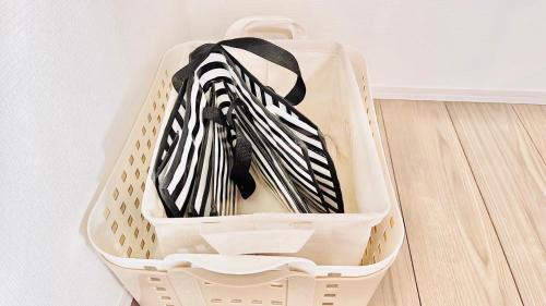 a suitcase filled with black and white ties at Megu Fuji Plus in Fujiyoshida