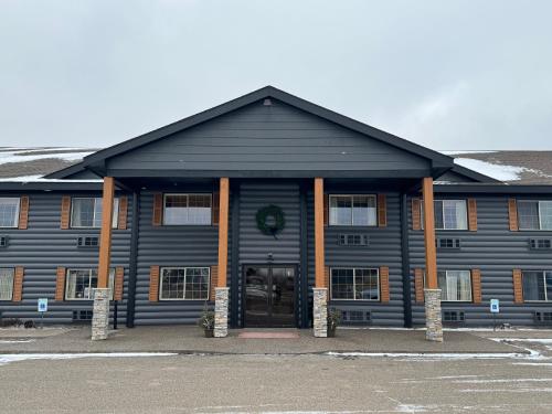 a large building with a door in front of it at Crossroads Hotel in McGregor