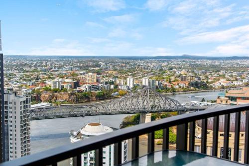 a view of a city from the balcony of a building at Top Floor! 2Bed/2Bath/1Car/Pool ~ VIEWS ~ CBD in Brisbane