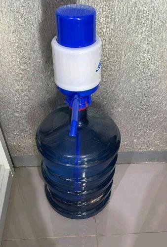 a blue and white bottle sitting on top of a stack of plates at Orchard Apartment Pakuwon Mansion 2 by Shinzhouz in Surabaya