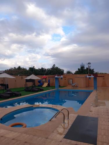 a swimming pool at a resort with at دايموند Diamond in AlUla