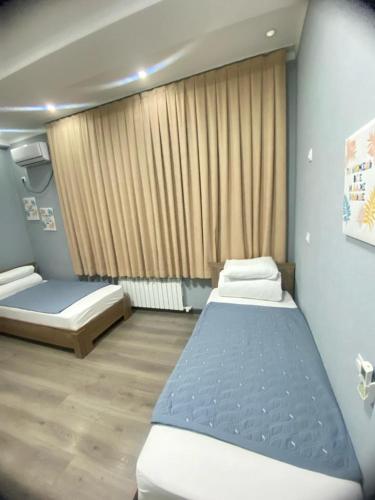 Inter Hotel Bishkekにあるベッド