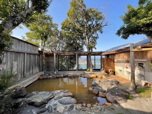 a pond in the backyard of a house at Yamamizuki in Shimanto