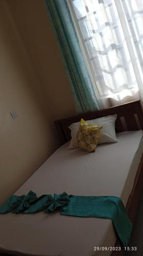 Un pat sau paturi într-o cameră la Joyful homes Air Bnb